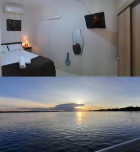 a room with a bed and a view of the water at Chalé Brisas do Rio in Petrolina