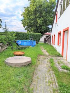 a picnic table and a bench in a yard at Urlaubsmagie- Pool, Terrasse, Barbecue - W4 in Lichtenhain