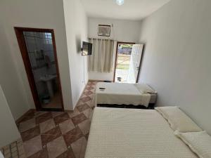 Postel nebo postele na pokoji v ubytování Pousada Recanto Vila Viçosa + 40 fotografií