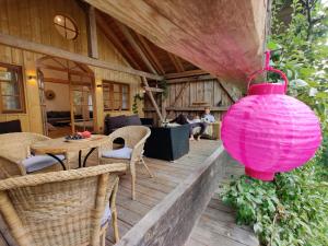 a pink lantern is hanging on a wooden deck at Kultur-Stadl Ferienwohnung 