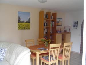 a living room with a table and a couch at Arbshagen in Groß Kordshagen
