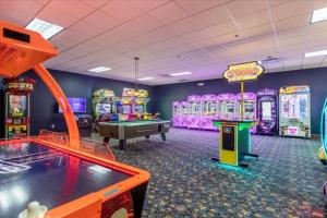 a gaming room with arcade games and a pool table at 4 Bedrooms 3 Bathrooms Paradise Palms 8963 Cat in Orlando