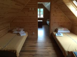 Кровать или кровати в номере Pauka Holiday House