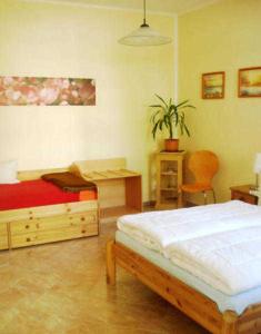 Ένα ή περισσότερα κρεβάτια σε δωμάτιο στο Haus Paula - Am Rhododendronpark