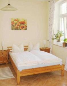 Ένα ή περισσότερα κρεβάτια σε δωμάτιο στο Haus Paula - Am Rhododendronpark