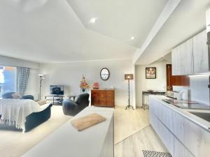 a living room with a bed and a kitchen at Vezelay, by Welcome to Cannes in Cannes +12 photos