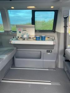 an inside view of a kitchen in an rv at Cookies Campers Dublin - Small Campervan in Dublin