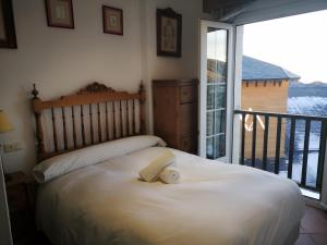 Un pat sau paturi într-o cameră la ViveSierraNevada PLAZA 1dorm DORNAJO junto ski telecabina Al andalus