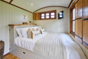 a bedroom with a bed in a tiny house at Host & Stay - Black Mountains Bespoke Breaks in Bronllys