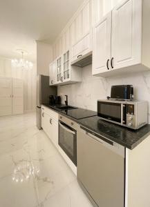 Kuchyň nebo kuchyňský kout v ubytování Stupartska - Premium Old Town Residence + 24 fotografií