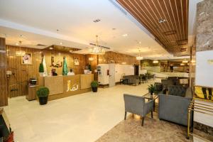 a lobby of a store with tables and chairs at لمار أجياد الاول Tower A in Mecca