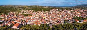 an aerial view of a town with red roofs at Luciano Home in Gonnesa