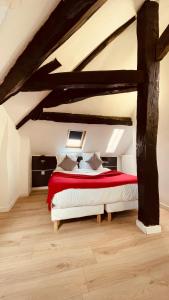 a bedroom with a large bed in an attic at Jeff Hotel in Paris