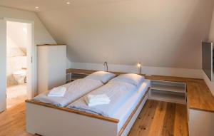 Ένα ή περισσότερα κρεβάτια σε δωμάτιο στο Ferienwohnung Vogelkoje