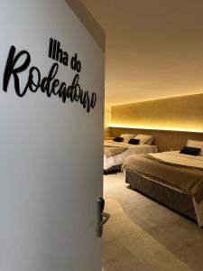 a room with two beds and a room with two beds at HOTEL NOVO CENTRO in Petrolina