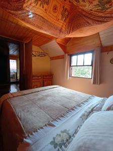 En eller flere senge i et værelse på Casa Dell Angelo Apartamentos