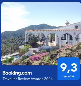 a building on a hill with mountains in the background at Holiday Home Tranquilidad in Arenas