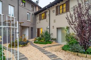 a garden in front of a building at Cascina Conicchio - Metro Station - by Host4U in Brescia