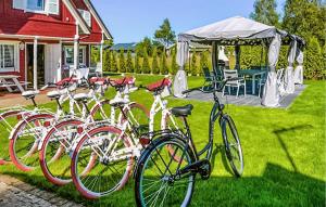 a group of bikes parked in front of a house at Lovely Home In Chlopy With Kitchen in Chłopy