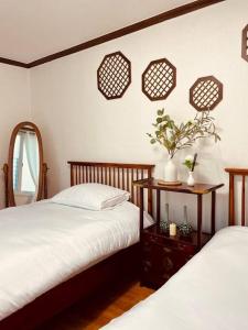 En eller flere senge i et værelse på Cheong Un Gak