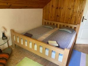 two bunk beds in a room with wooden walls at Lasica in Žabljak