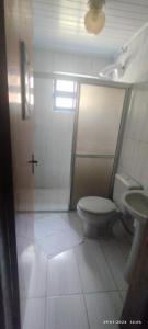 a bathroom with a toilet and a sink at Pousada Águia da Serra Gramado 1 in Gramado