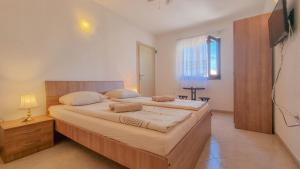 a bedroom with a large bed in a room at Lucijana Room in Novigrad Istria