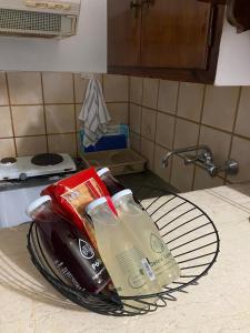 a basket of groceries sitting on a kitchen counter at Alexandra Studios in Neos Pirgos +54 photos