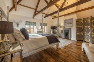 a bedroom with a bed and a living room at Little Star in Ringstead