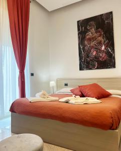 a bedroom with a bed with a painting on the wall at Il vecchio Fauno in Pompei
