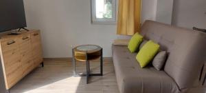 a living room with a couch and a table at Villa A&M in Vinišće