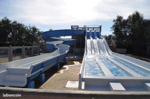a water slide in a park with a swimming pool at mobil home in Palavas-les-Flots