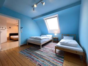 Krevet ili kreveti u jedinici u objektu Übernachten in großer Maisonette-Wohnung by Rabe