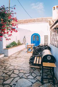 a motorcycle parked in front of a house at THALASSA New house in Leonidion
