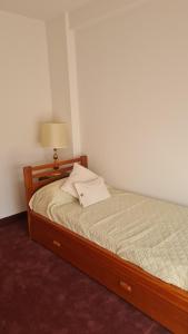 Postel nebo postele na pokoji v ubytování Departamento céntrico calle 12