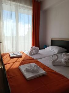 Postel nebo postele na pokoji v ubytování Hotel Cosmos