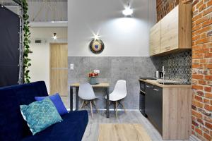 O bucătărie sau chicinetă la Apartamenty Matejki