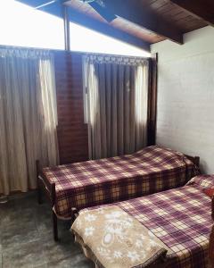 Łóżko lub łóżka w pokoju w obiekcie Casa de Campo Tierra de ensueños