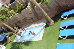 an overhead view of a group of people in a swimming pool at Hotel RH Victoria & Spa 4 Sup in Benidorm