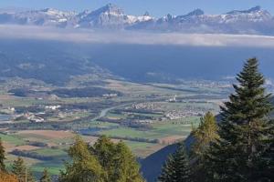 a view of a lake with mountains in the background at Torgon Grand studio Confortable in Torgon