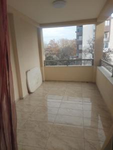an empty room with a large window and a balcony at Hana's Luxury apartment in Skopje