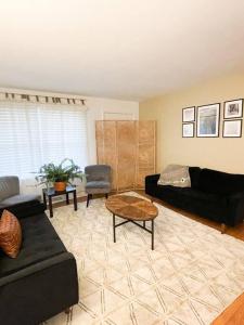 a living room with a couch and a table at Hidden GEM W1 king bed &2 queens in Winston-Salem