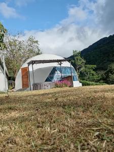 a tent in the middle of a field at Glamping Karl in Monteverde Costa Rica