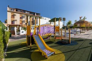 a playground with a slide in a park at Hotel Avenida Tropical by Bossh! Hotels in Salobreña