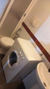 a bathroom with a toilet and a sink at Romeo house in Naples