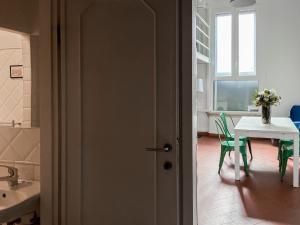 a bathroom with a table and a sink and a door at Lovely Apartment near Piazza della Signoria in Florence