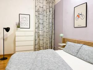 Ένα ή περισσότερα κρεβάτια σε δωμάτιο στο Lovely Apartment near Piazza della Signoria