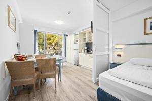 Ein Bett oder Betten in einem Zimmer der Unterkunft Family Resort del Mar