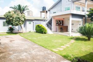 a house with a lawn in front of it at EAGLE in Ouéto