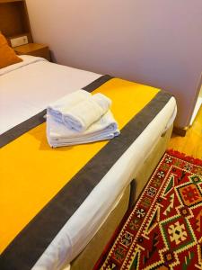 a pair of beds with towels on top of them at Lebon Hotel-Special Class in Istanbul
